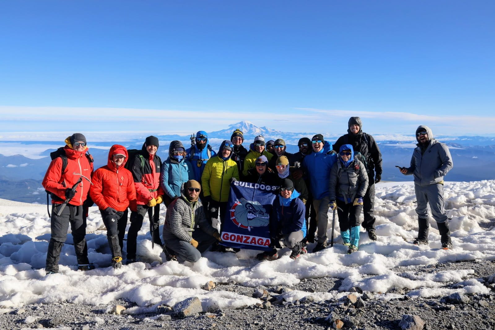 Group of climbers at the summit of Mt. Adams holding a Gonzaga Bulldogs flag